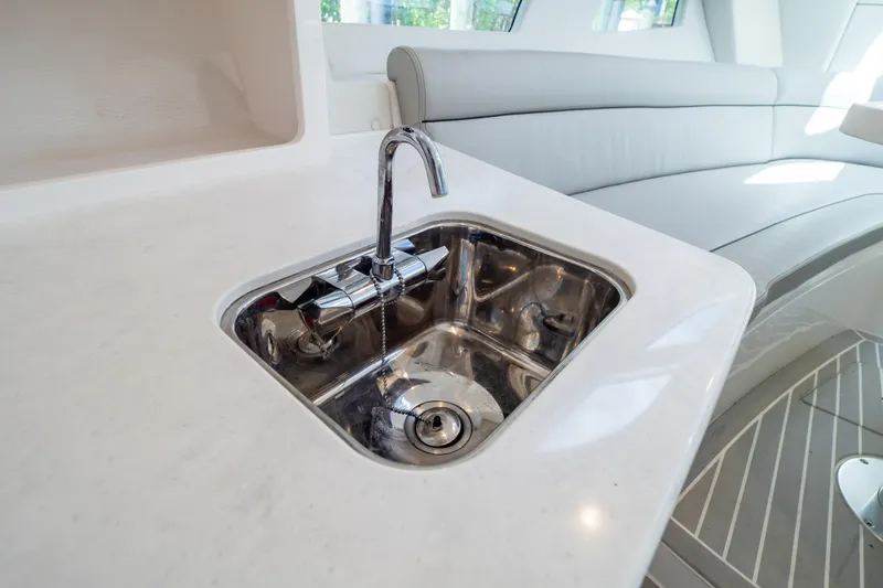  Yacht Photos Pics Luxury interior of 2023 Intrepid 345 Valor yacht featuring a sleek sink design.