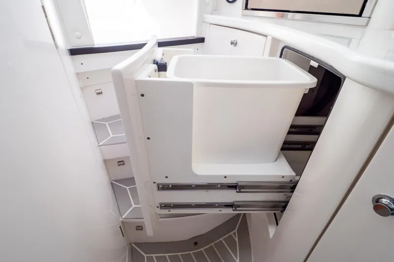  Yacht Photos Pics 2023 Intrepid 345 Valor interior with pull-out storage and modern design.