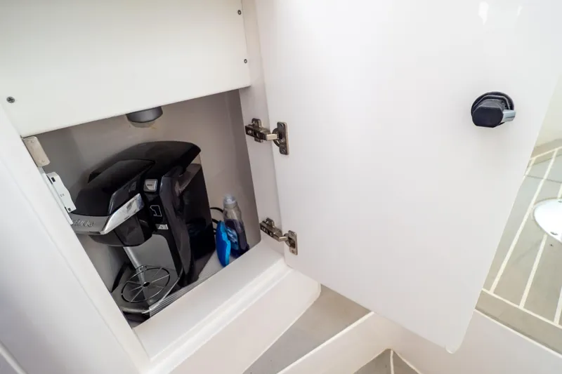  Yacht Photos Pics Cabinet with coffee maker inside 2023 Intrepid 345 Valor boat.