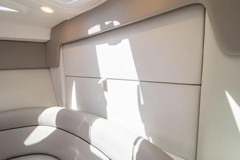  Yacht Photos Pics 2023 Intrepid 345 Valor interior with modern seating and soft lighting.