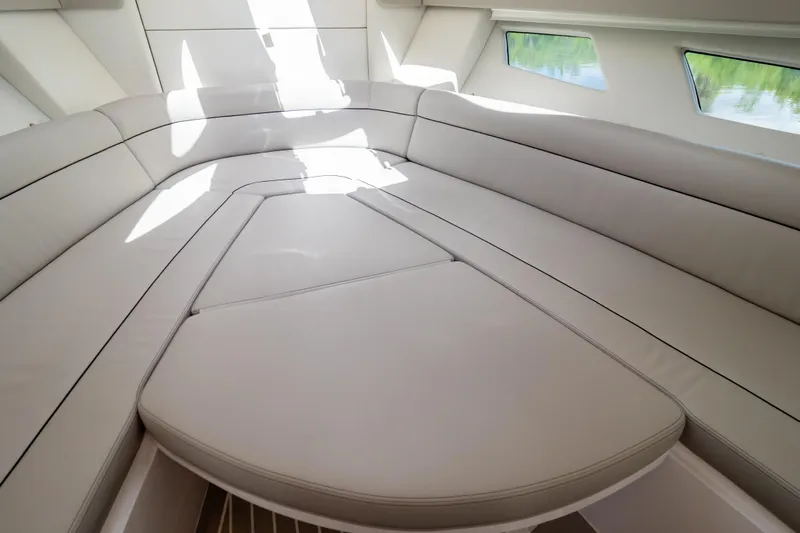  Yacht Photos Pics 2023 Intrepid 345 Valor interior with luxurious seating and modern design.