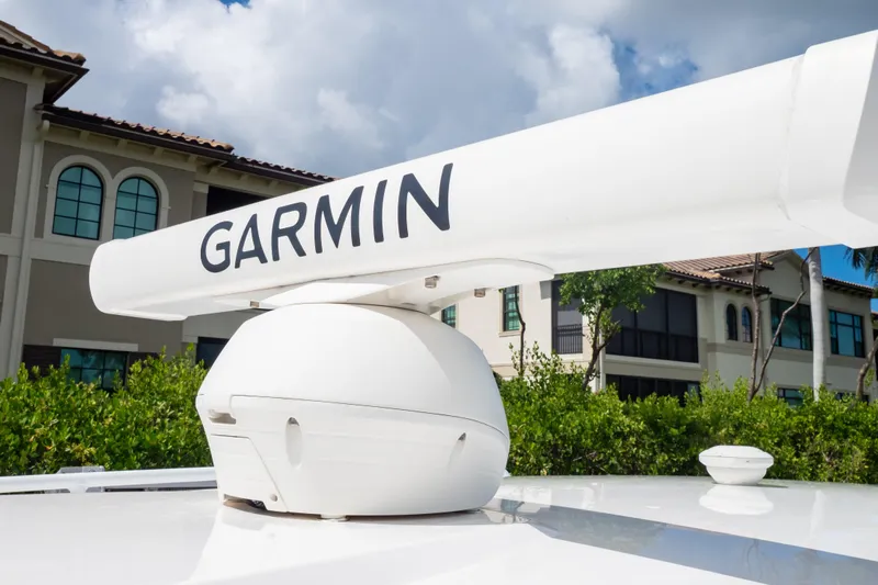  Yacht Photos Pics Garmin radar on 2023 Intrepid 345 Valor boat, with residential background.