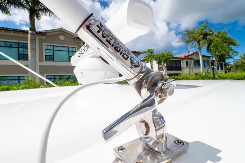  Yacht Photos Pics Close-up of 2023 Intrepid 345 Valor boat antenna with buildings in background.