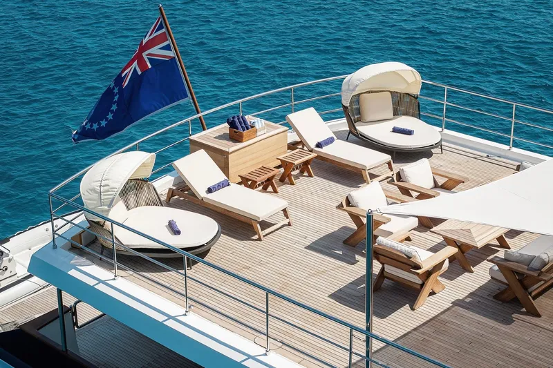 Koru Yacht Photos Pics Luxurious 1983 Feadship Custom yacht deck with sun loungers and ocean view.