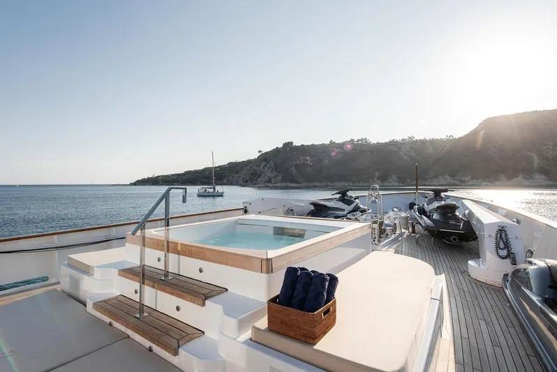 Koru Yacht Photos Pics Luxurious 1983 Feadship Custom yacht deck with hot tub and ocean view.