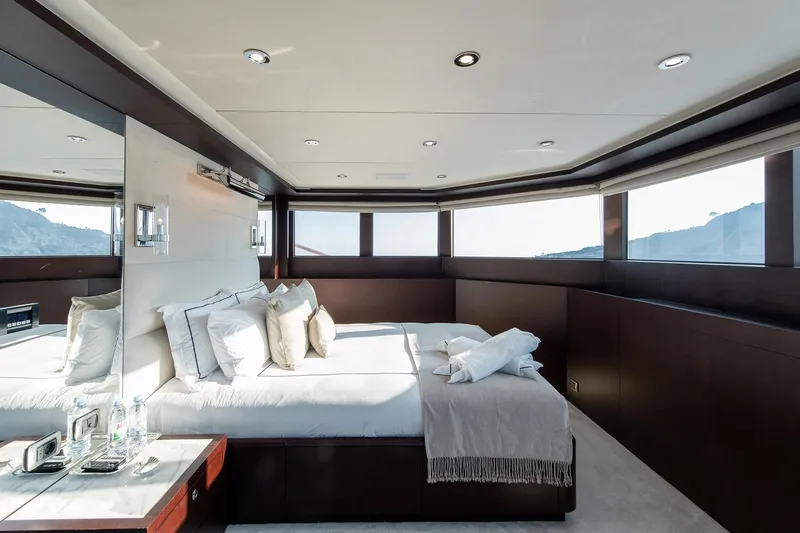 Koru Yacht Photos Pics Luxurious bedroom interior on 1983 Feadship Custom yacht with panoramic windows.