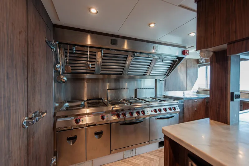Koru Yacht Photos Pics Luxurious yacht kitchen with stainless steel appliances, Feadship Custom 1983 model.