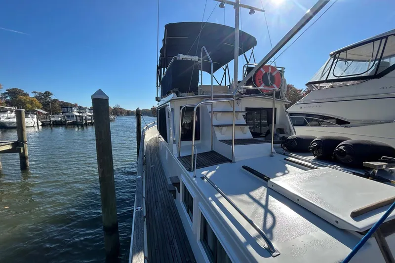 Radius Yacht Photos Pics 1986 Grand Banks 42 Classic yacht docked in a sunny marina.
