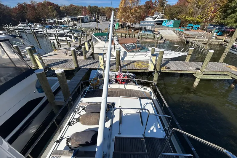 Radius Yacht Photos Pics 1986 Grand Banks 42 Classic yacht docked at a marina with surrounding boats.