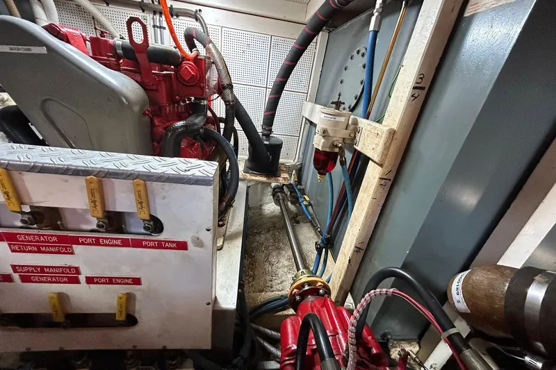 Radius Yacht Photos Pics Engine room of 1986 Grand Banks 42 Classic, showcasing generator and manifold system.