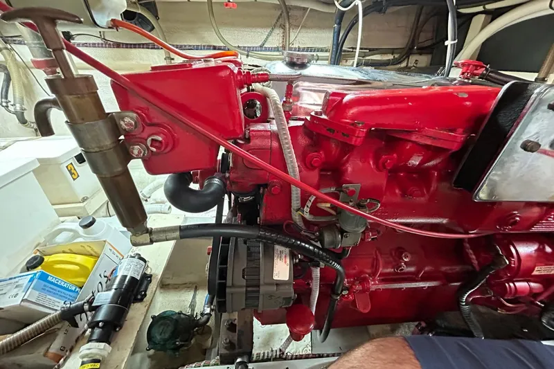 Radius Yacht Photos Pics Engine room of 1986 Grand Banks 42 Classic with red machinery and various components.