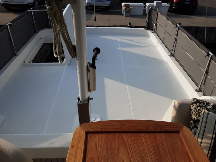  Yacht Photos Pics 2014 Beneteau Swift Trawler 34 deck with wooden accents and railing.