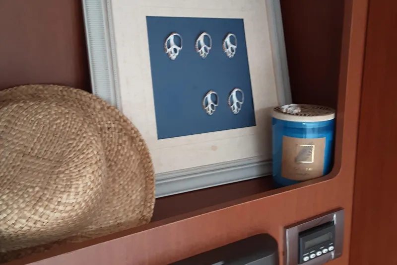  Yacht Photos Pics Interior shelf of 2014 Beneteau Swift Trawler 34 with decor items.