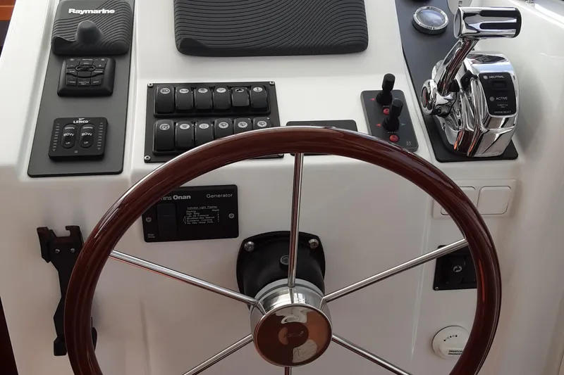  Yacht Photos Pics Steering wheel and controls of 2014 Beneteau Swift Trawler 34 boat.