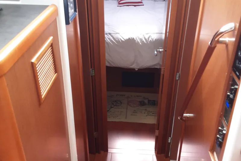  Yacht Photos Pics Interior view of 2014 Beneteau Swift Trawler 34, featuring a cozy cabin entrance.