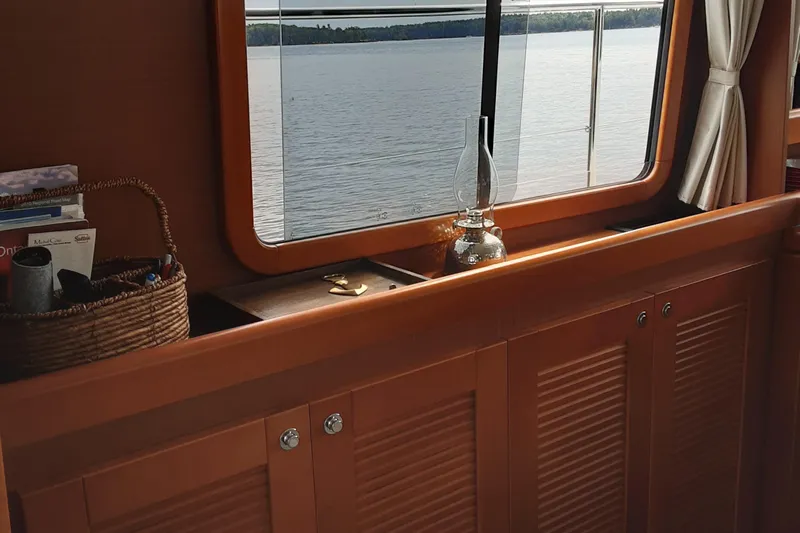  Yacht Photos Pics Interior of 2014 Beneteau Swift Trawler 34 with window view of water.