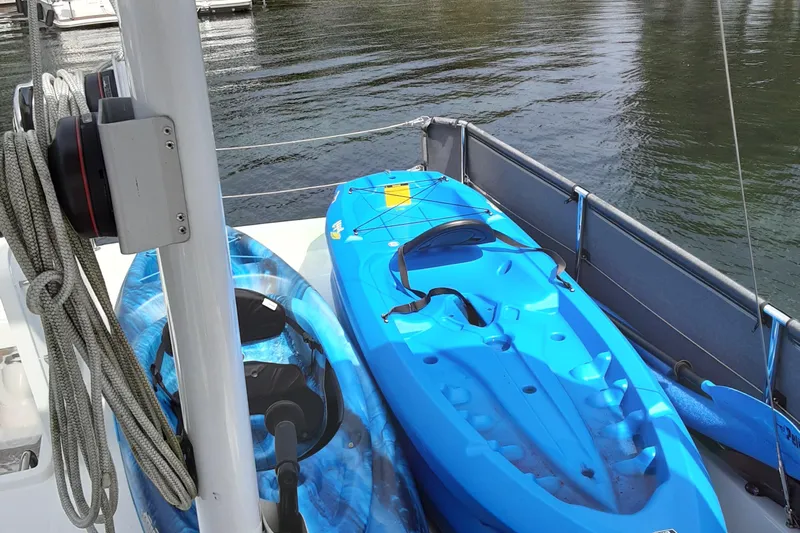  Yacht Photos Pics Two kayaks on a 2014 Beneteau Swift Trawler 34, docked by the water.