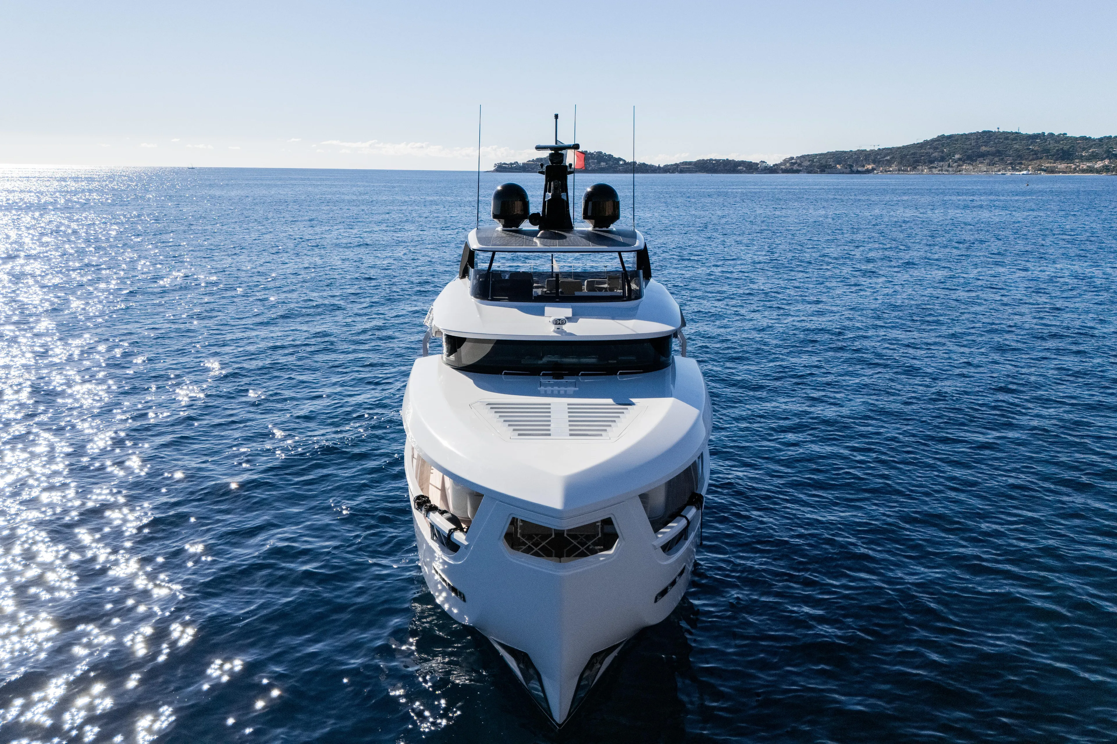  Yacht Photos Pics 2025 Ferretti Yachts INFYNITO 80 cruising on open sea, front view.