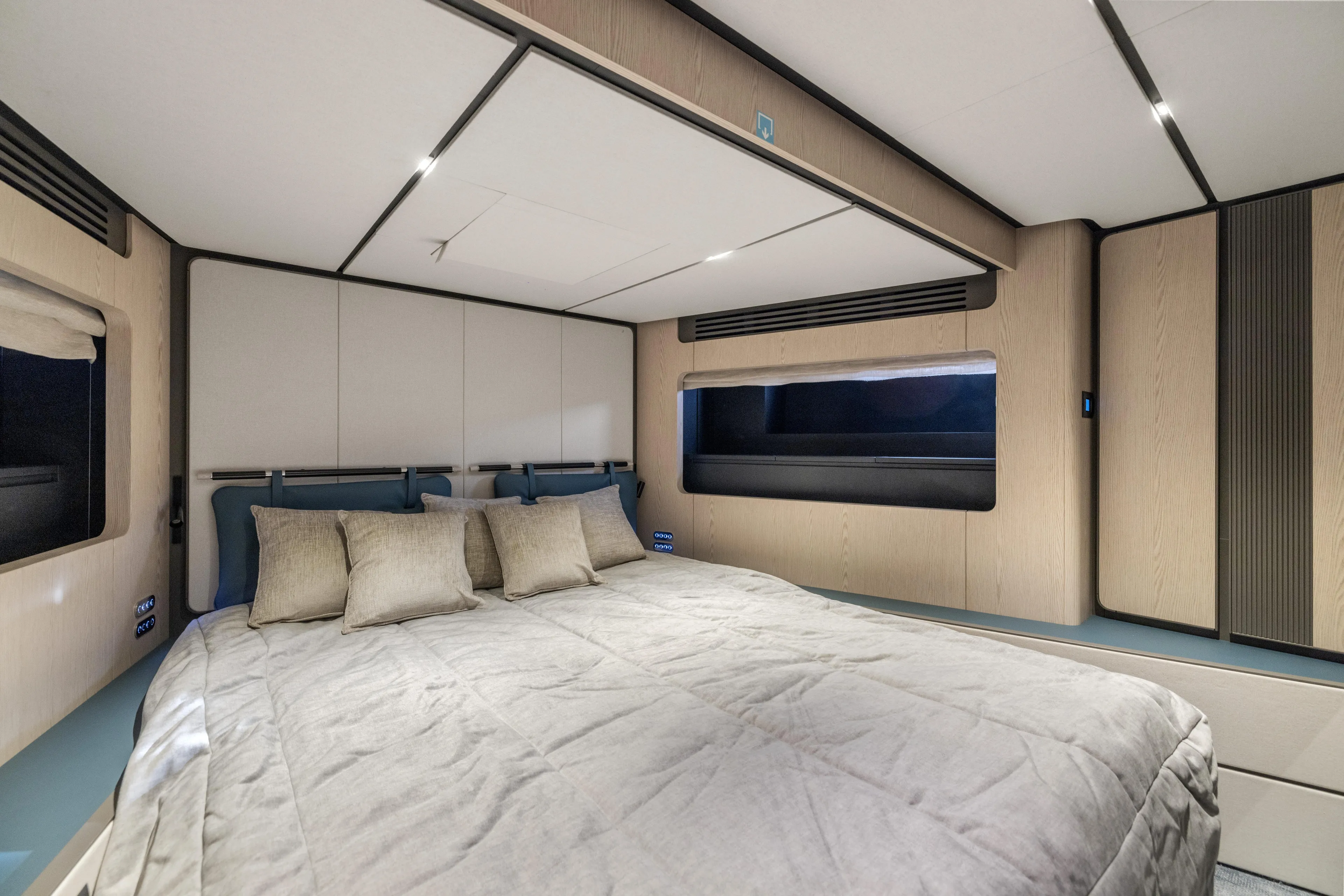  Yacht Photos Pics Luxurious bedroom interior of 2025 Ferretti Yachts INFYNITO 80, featuring modern design and cozy bedding.