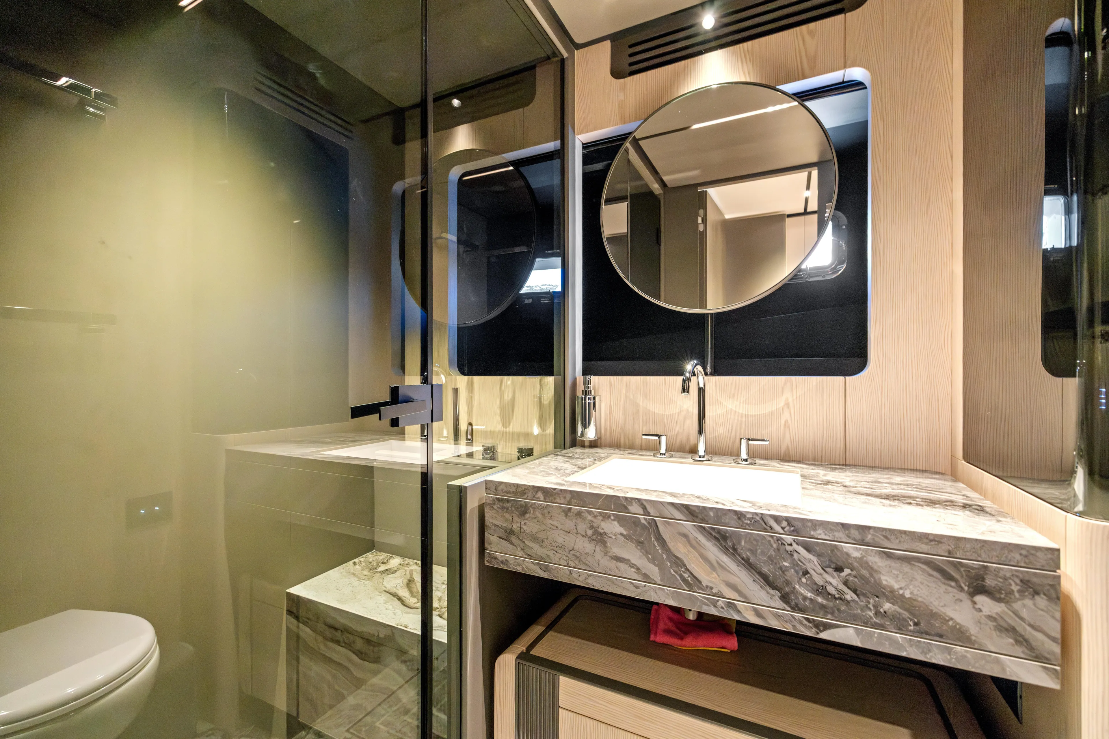  Yacht Photos Pics Luxurious bathroom in 2025 Ferretti Yachts INFYNITO 80, featuring elegant marble countertop and modern fixtures.