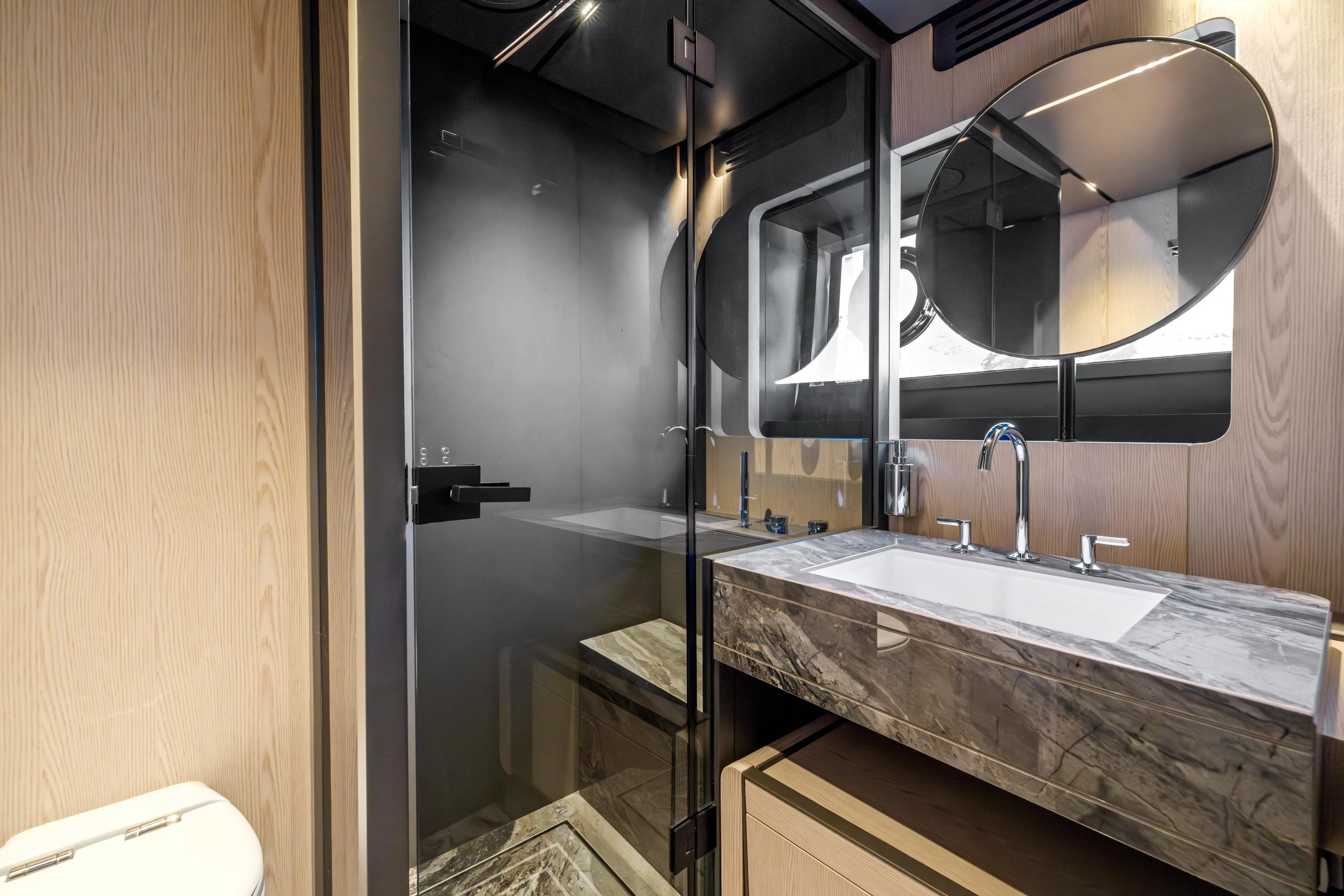  Yacht Photos Pics Luxurious bathroom in 2025 Ferretti Yachts INFYNITO 80, featuring modern fixtures and elegant design.