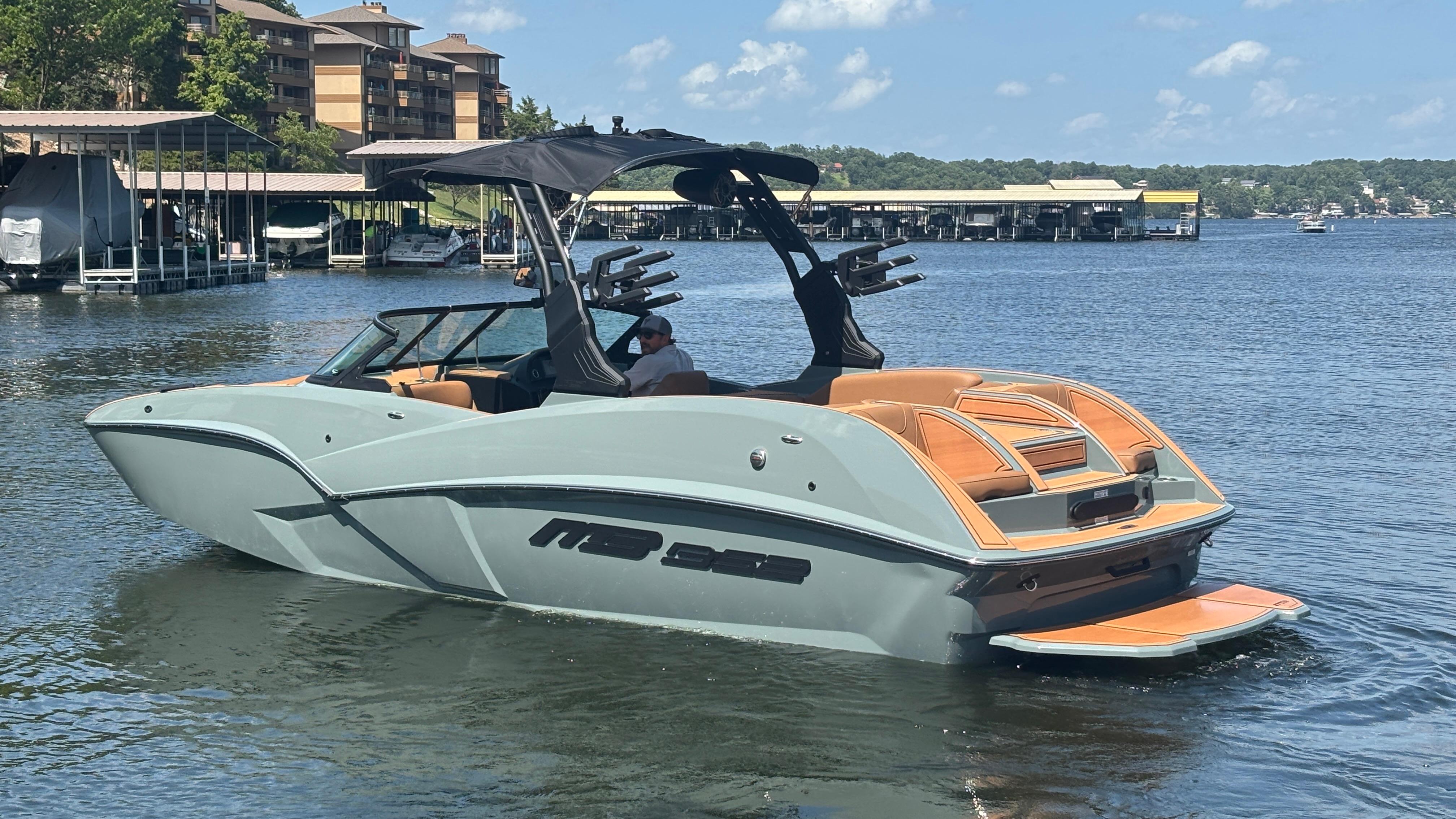 2025 MB B52 25 Alpha boat on a lake, featuring sleek design and modern amenities.