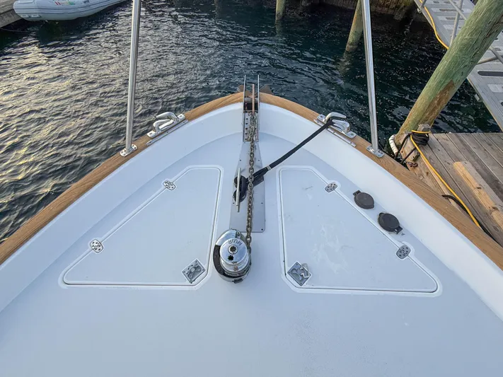 Waypoint Yacht Photos Pics Bow of 2002 Legacy 34 Express boat docked at marina.