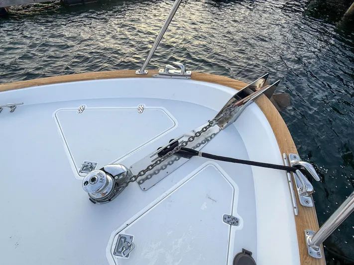 Waypoint Yacht Photos Pics Bow of 2002 Legacy 34 Express boat with anchor and chain mechanism.