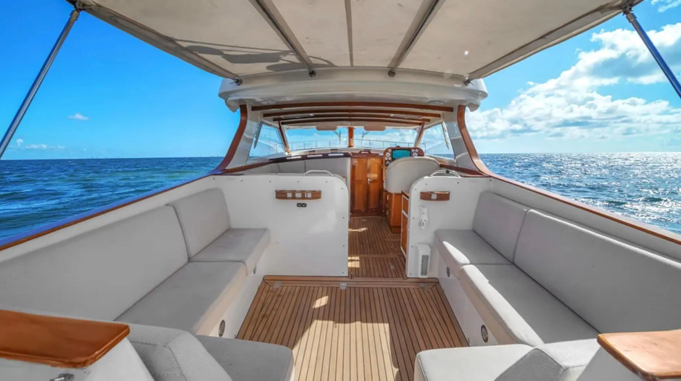 Luxurious 2010 Custom Gentleman's Motor Yacht interior with ocean view and elegant seating.