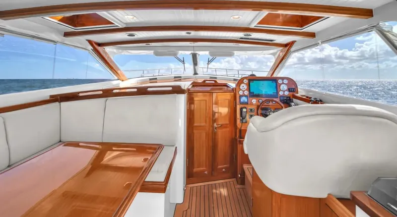 Noi Qauttro Yacht Photos Pics Luxurious 2010 Custom Gentleman's Motor Yacht interior with polished wood and ocean view.