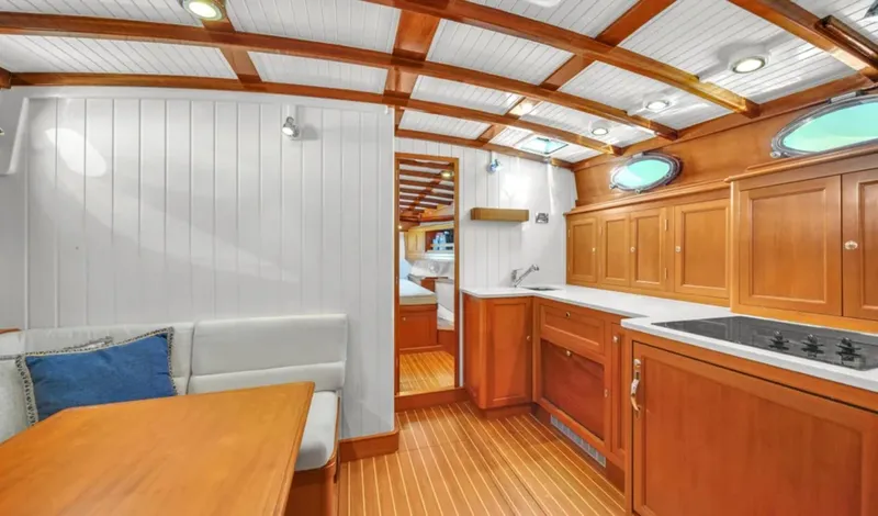 Noi Qauttro Yacht Photos Pics Luxurious interior of 2010 Custom Gentleman's Motor Yacht with wood finishes and modern amenities.