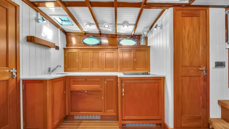 Noi Qauttro Yacht Photos Pics Luxurious wooden interior of a 2010 Custom Gentleman's Motor Yacht kitchen.