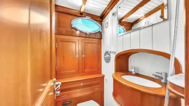 Noi Qauttro Yacht Photos Pics Luxurious wooden bathroom interior on a 2010 Custom Gentleman's Motor Yacht.
