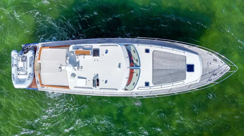 Noi Qauttro Yacht Photos Pics Aerial view of a 2010 Custom Gentleman's Motor Yacht on green water.