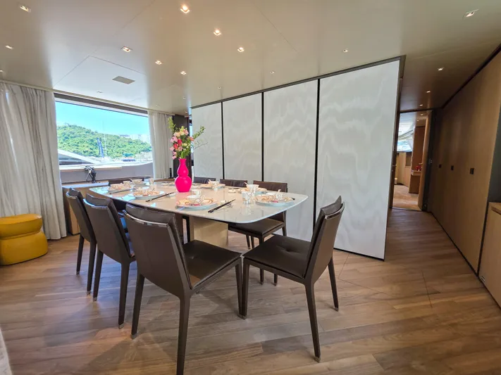  Yacht Photos Pics Luxurious dining area on 2025 Sanlorenzo SD90 yacht, featuring elegant table setting and modern decor.