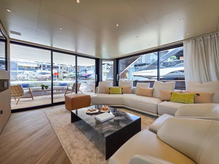  Yacht Photos Pics Luxurious interior of 2025 Sanlorenzo SD90 yacht with modern furnishings and marina view.