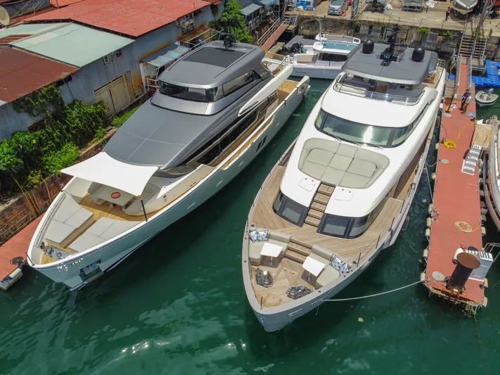  Yacht Photos Pics Two luxurious Sanlorenzo SD90 yachts docked side by side, 2025 models.