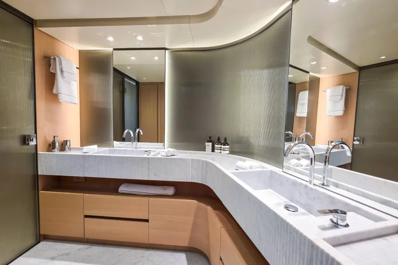  Yacht Photos Pics Luxurious bathroom in 2025 Sanlorenzo SD90 yacht with modern fixtures and elegant design.