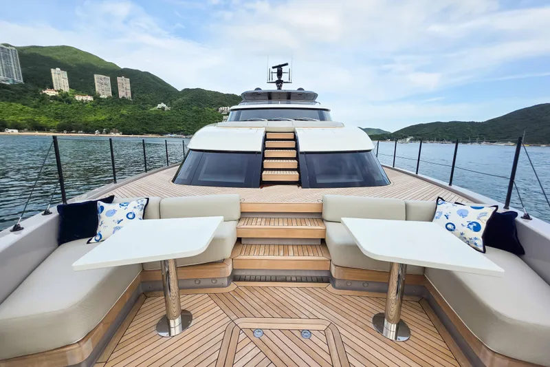  Yacht Photos Pics Luxurious 2025 Sanlorenzo SD90 yacht deck with seating, tables, and scenic ocean view.