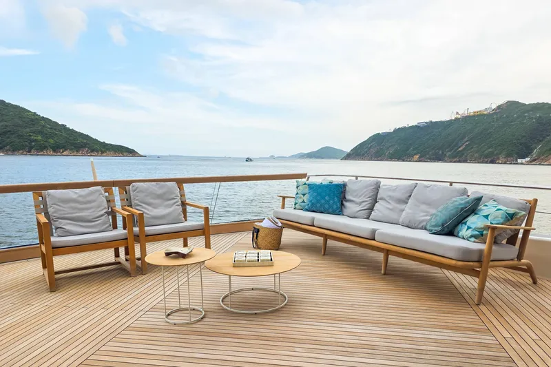  Yacht Photos Pics Luxury deck of 2025 Sanlorenzo SD90 yacht with elegant seating and ocean view.