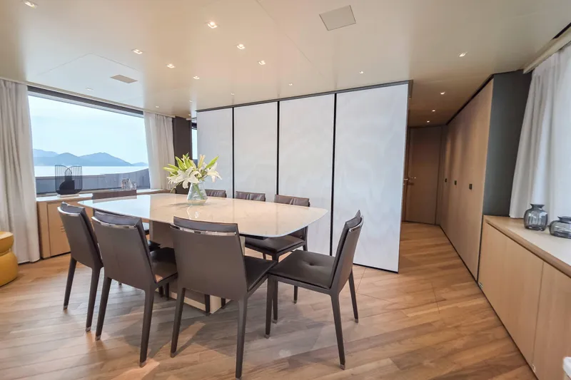  Yacht Photos Pics Luxurious dining area on 2025 Sanlorenzo SD90 yacht with elegant table and chairs.