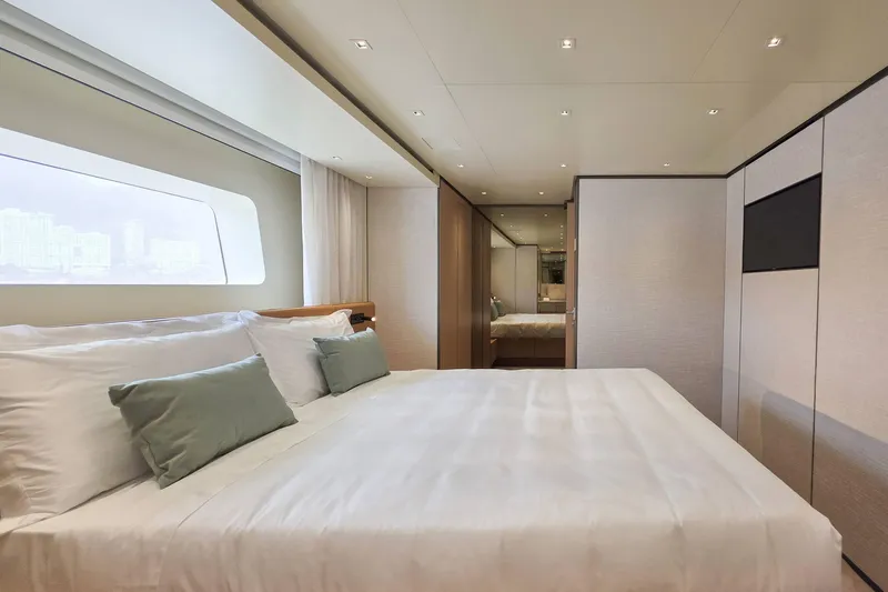  Yacht Photos Pics Luxurious bedroom interior of 2025 Sanlorenzo SD90 yacht with modern design and large window.