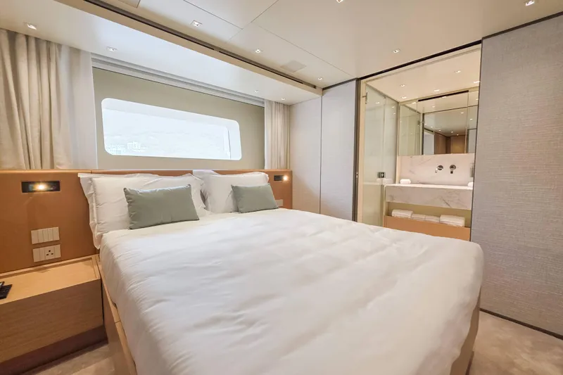  Yacht Photos Pics Luxurious bedroom interior of 2025 Sanlorenzo SD90 yacht with modern design and ensuite bathroom.