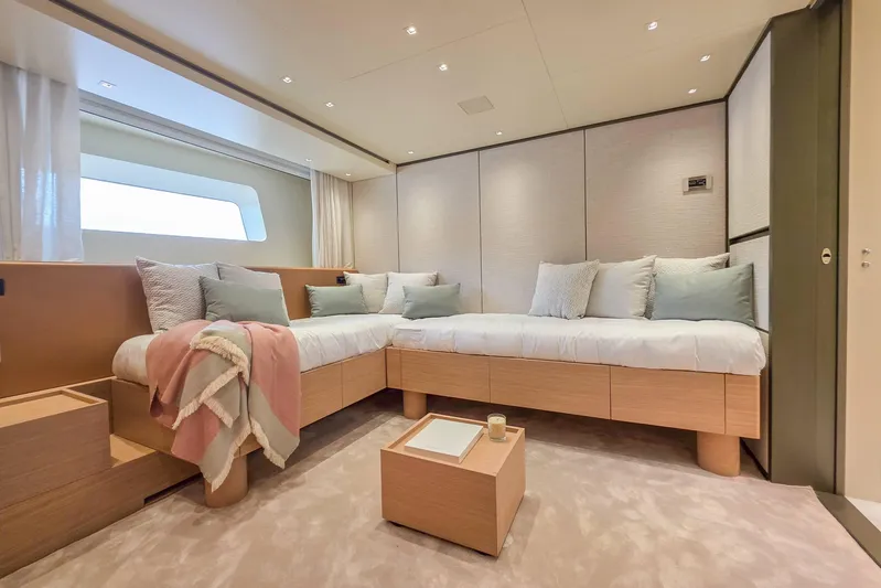  Yacht Photos Pics Luxurious bedroom interior of 2025 Sanlorenzo SD90 yacht with modern design and cozy bedding.