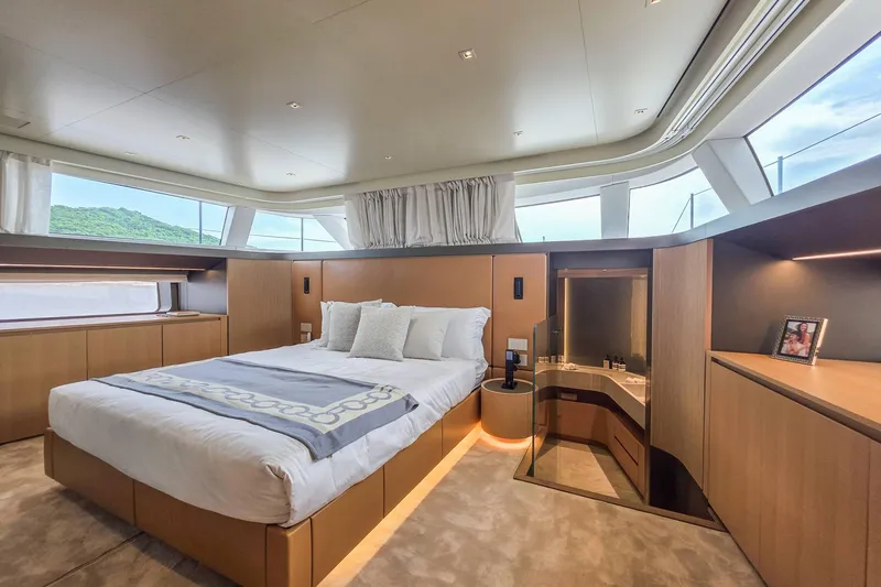  Yacht Photos Pics Luxurious bedroom interior of 2025 Sanlorenzo SD90 yacht with modern design and large windows.