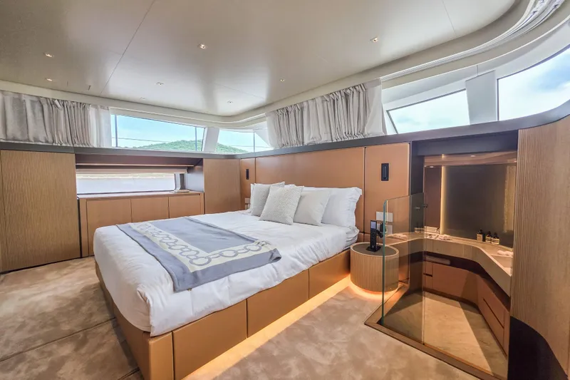  Yacht Photos Pics Luxurious bedroom interior of 2025 Sanlorenzo SD90 yacht with modern design and large windows.