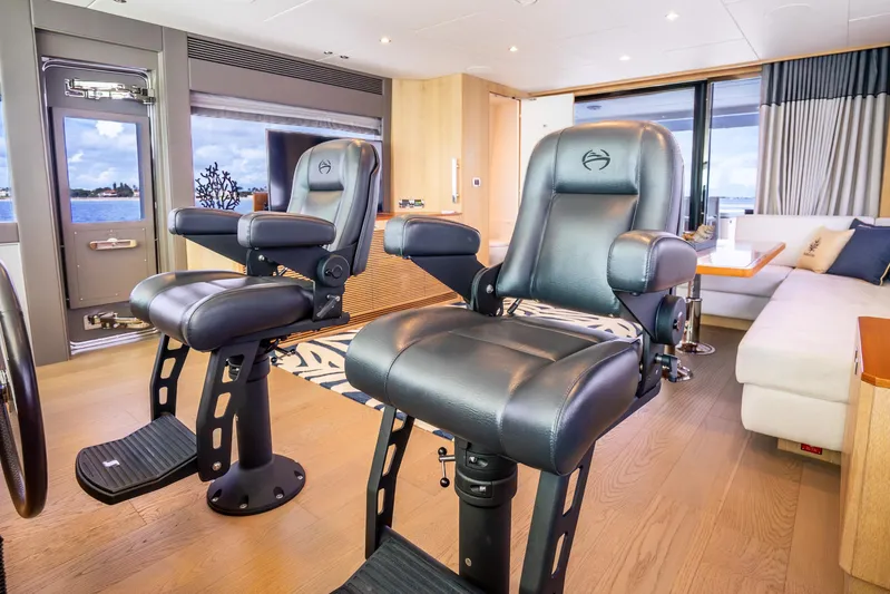 One More Time Yacht Photos Pics Luxurious interior of 2020 Horizon FD80 yacht with plush seating and ocean view.