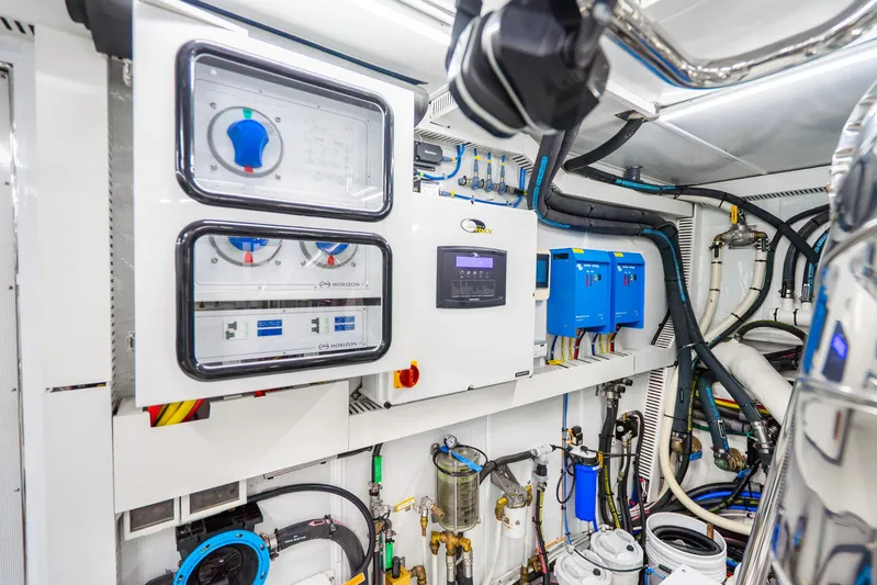 One More Time Yacht Photos Pics Engine room of 2020 Horizon FD80 yacht with control panels and wiring.