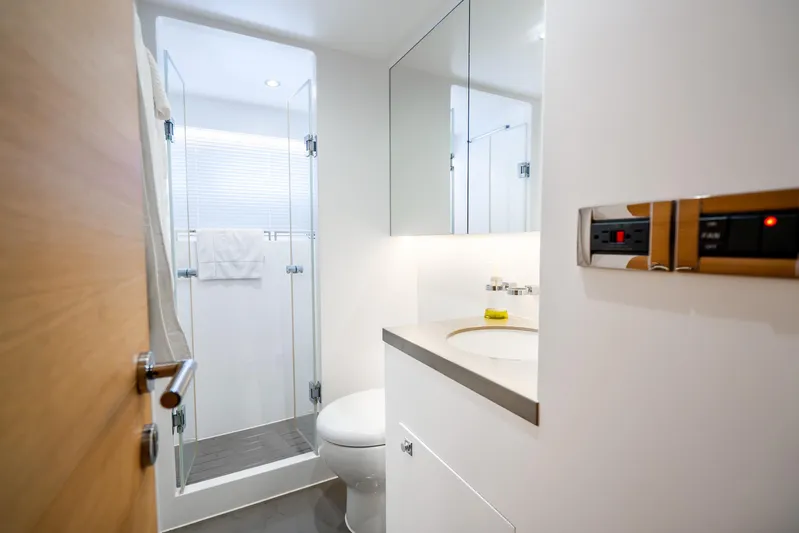 One More Time Yacht Photos Pics Modern bathroom in 2020 Horizon FD80 yacht with shower and sleek fixtures.