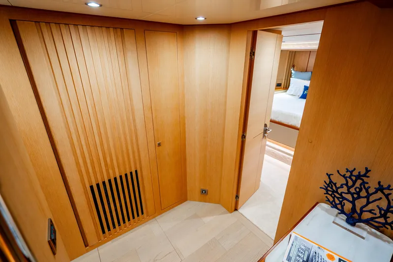 One More Time Yacht Photos Pics Luxurious interior of 2020 Horizon FD80 yacht with wooden paneling and modern decor.